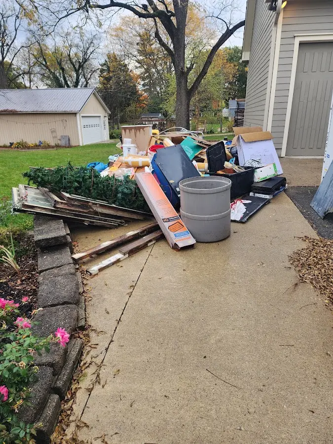 Dumpster being loaded with debris for Commercial Dumpster Rental in Broomfield